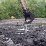 Excavator on sludge